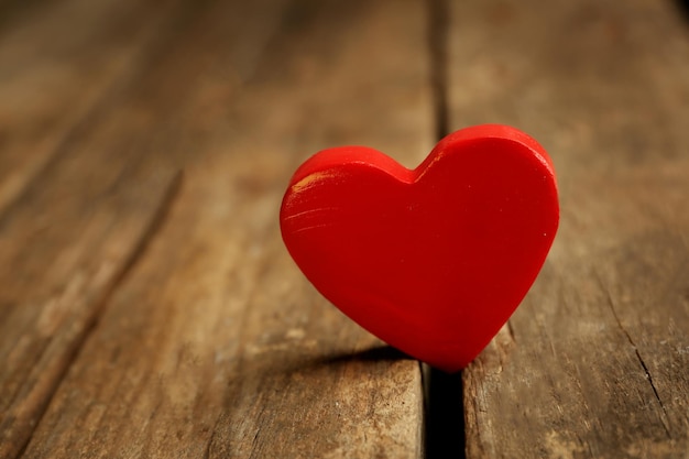 Wooden heart on rustic wooden background