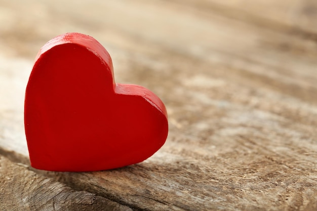 Wooden heart on rustic wooden background