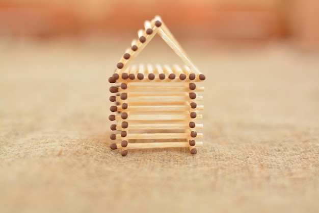 Wooden house made of matches Handmade Blurring background Free place