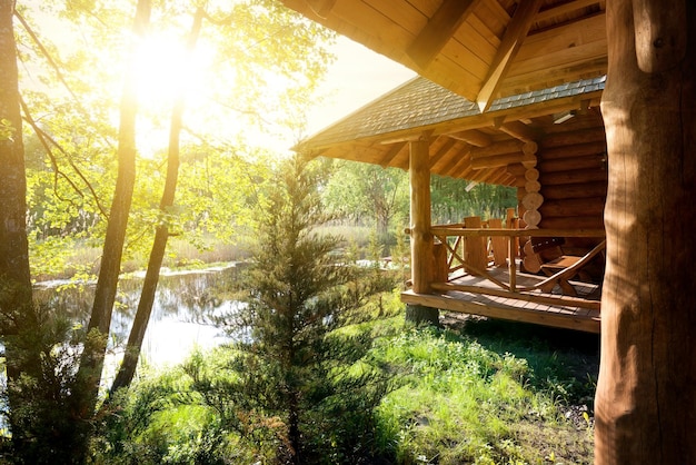 Wooden house and pond at the sunrise