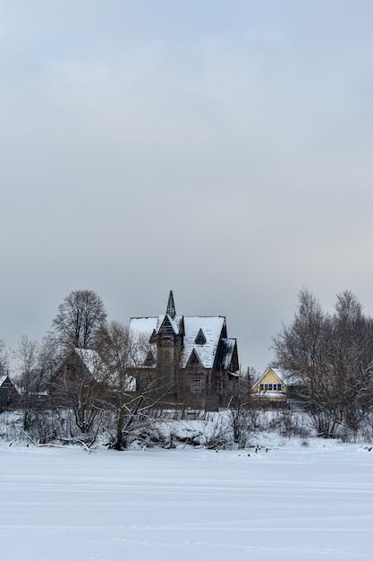 Wooden house on the river bank