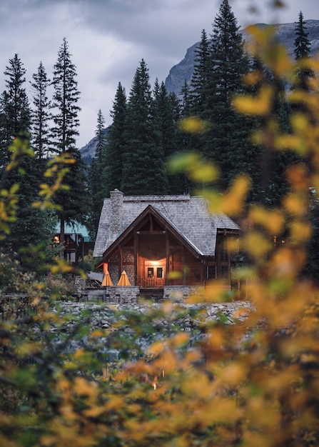 Wooden house with autumn leaves on Emerald lake in Yoho national park