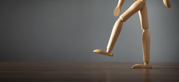 Wooden human figure on the table