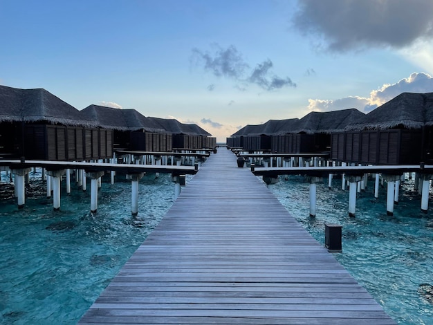 A wooden jetty in a luxury resort baa atoll maldives