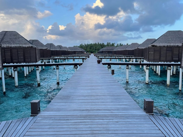 A wooden jetty in a luxury resort baa atoll maldives