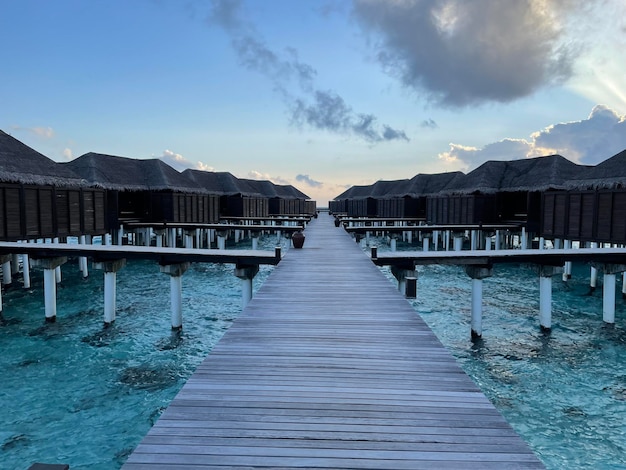 A wooden jetty in a luxury resort baa atoll maldives