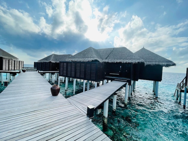 A wooden jetty in a luxury resort baa atoll maldives