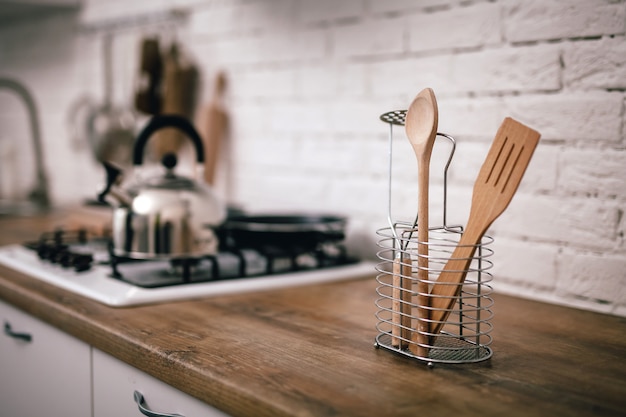 Wooden kitchen appliances stand on countertops