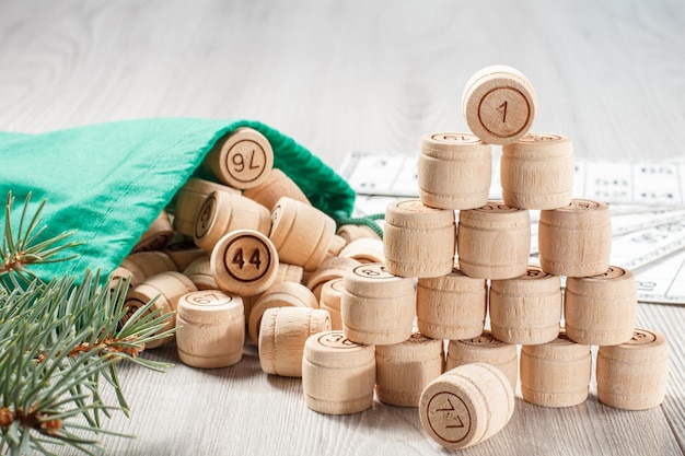 Wooden lotto barrels with bag game cards for a game in lotto