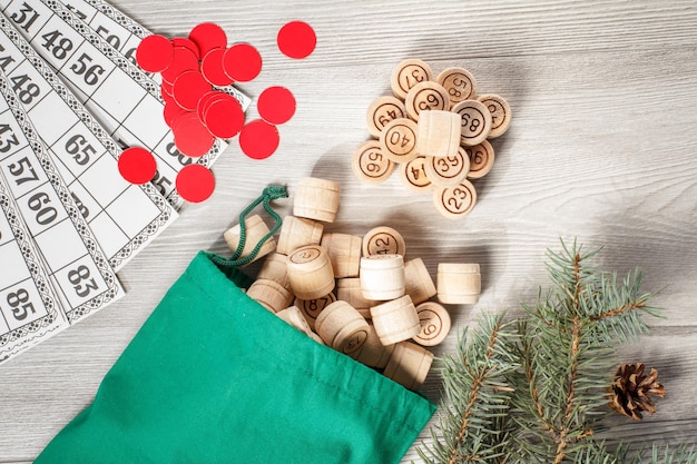 Wooden lotto barrels with bag and game cards for a game in lotto