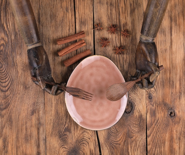 wooden mannequin hands and cutlery