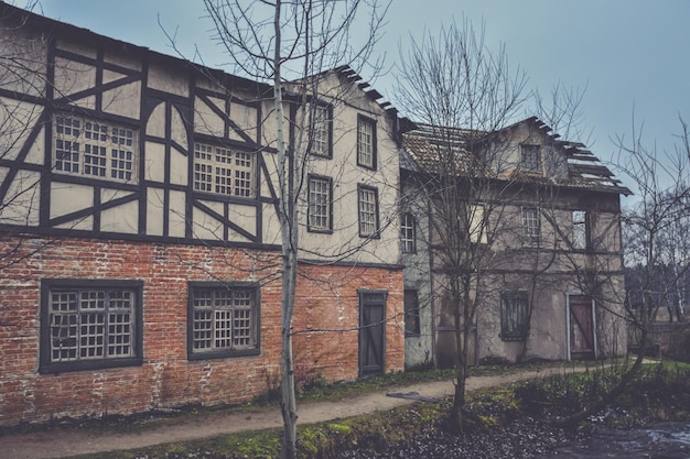 wooden medieval European house, construction of an European city, old European style wooden house, wooden bridge on the background of the house