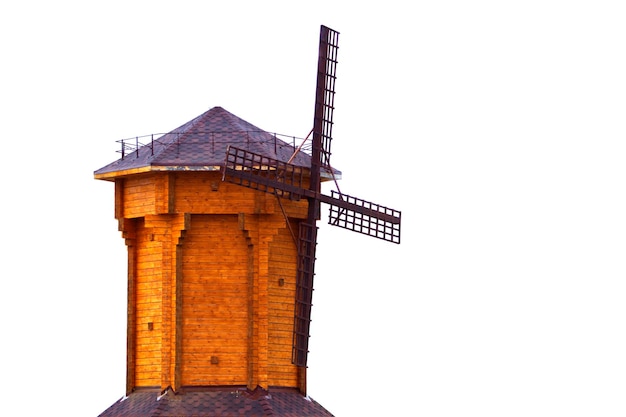 Wooden model of an old windmill on a white background