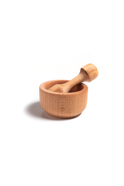 Wooden mortar with pestle isolated on a white background