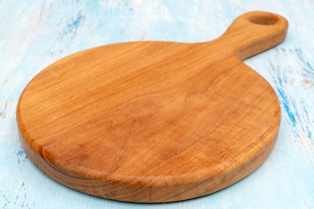 Wooden oak cutting board. Kitchenware. Copy space.