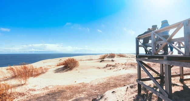 Wooden observation deck with stationary observation metal binoculars