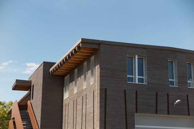 Wooden office building under a blue sky