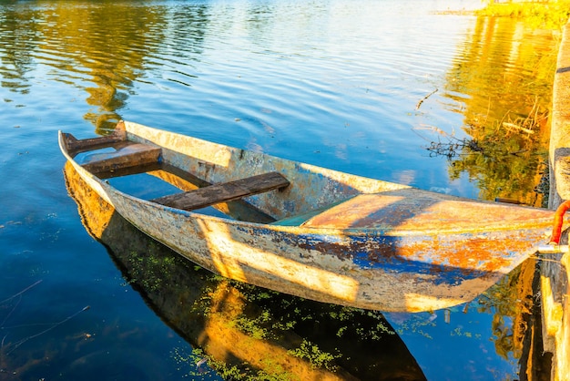 Wooden old fishing boat on river