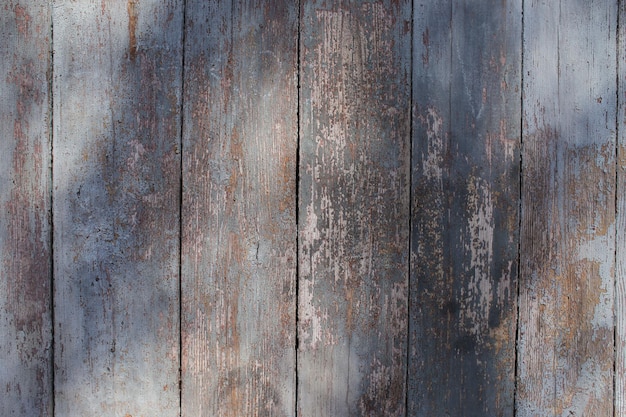 Wooden old shabby colored wall in full screen Photographed at close range