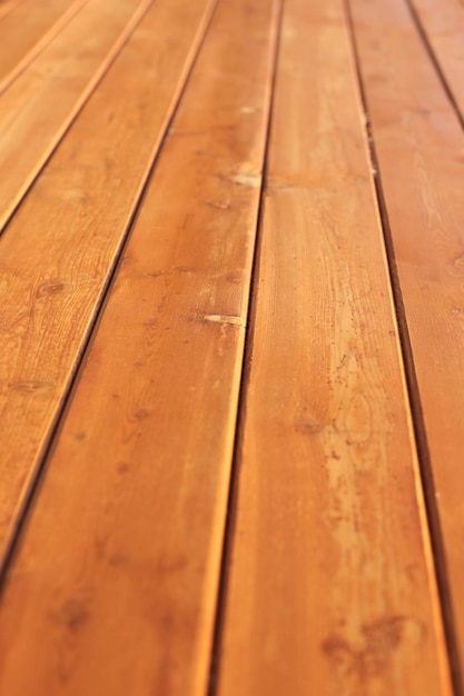 Wooden old wall made of boards lit by the sun full screen