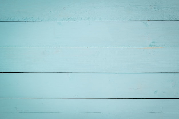 Wooden painting with aqua pastel color as background   