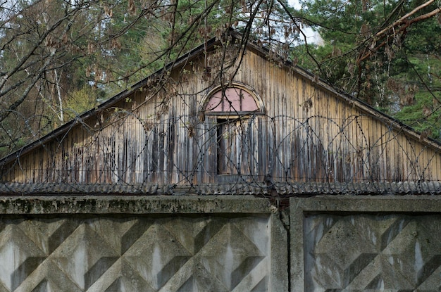 Wooden pediment of an old building in a pine forest Moscow region Russia