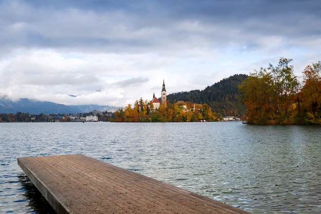 Wooden Pier on the Alpine Lake Bled Autumn in Slovenia Europe