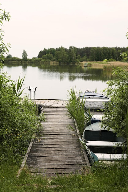 Wooden pier on big lake in Europe vertical view