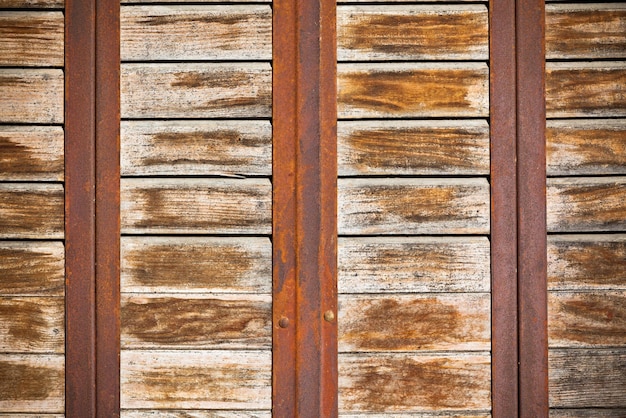 Wooden planks surface with rusty metal bands background