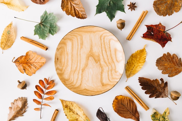 Wooden plate among leave