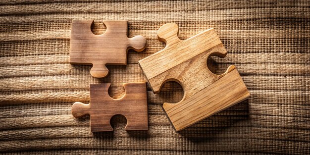 Photo wooden puzzle on textured background mind teaser game concept