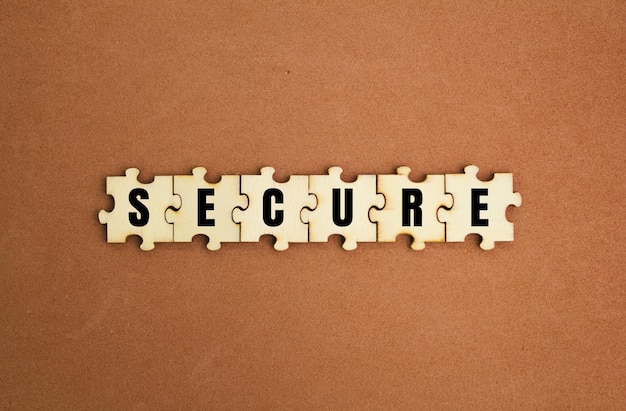 wooden puzzle with the word secure the concept of security or safe protection concept