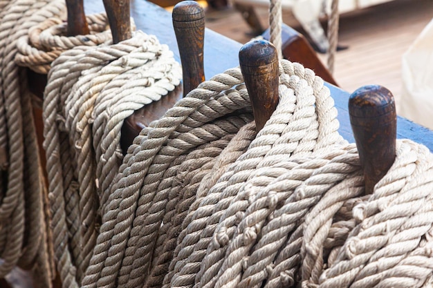 Wooden racks with spare ropes on an old wooden ship closeup