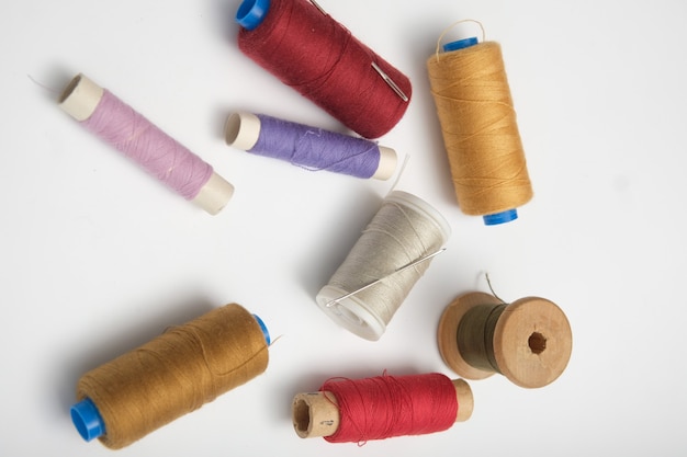 Wooden reels with thread on a solid background. tinting