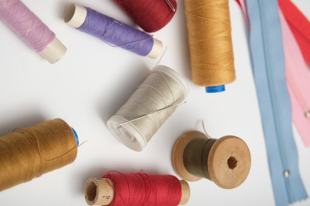 Wooden reels with thread on a solid background. tinting