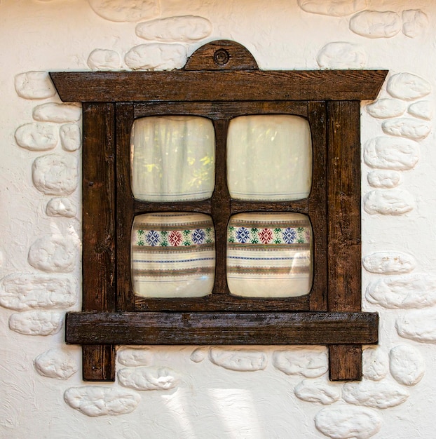 Wooden rustic window on a concrete wall