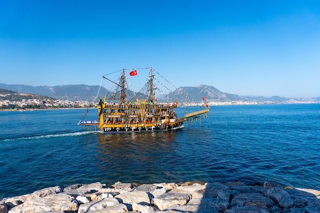 Wooden ship and Old Alanya Popular tourist destination in Turkey Summer travel vacation