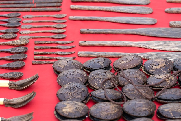 Wooden souvenirs for tourists at street market in Thailand Souvenirs that make from coconut shell