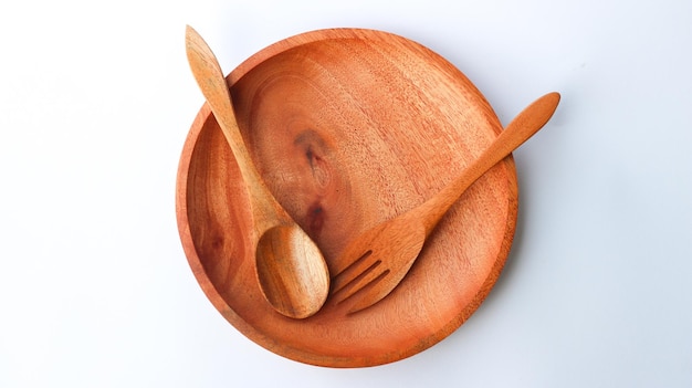 Wooden spoon and fork on a plate