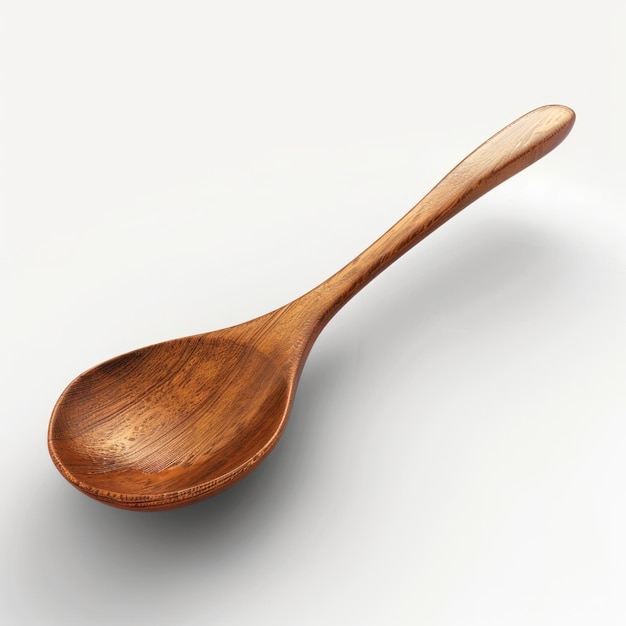 a wooden spoon is upside down on a white surface