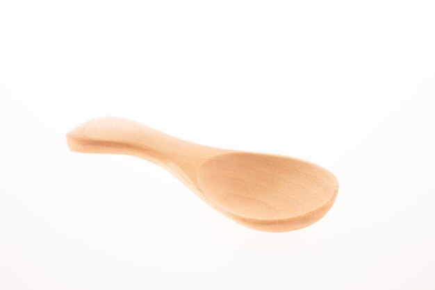 Wooden spoon isolated on white background