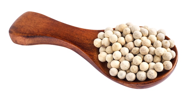 Wooden spoon and peppercorn on white background