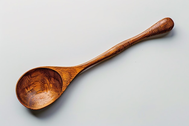 a wooden spoon on a white surface