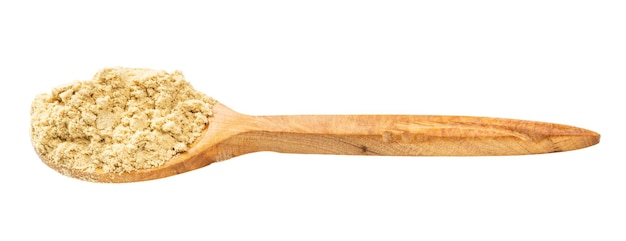 Wooden spoon with ginger powder isolated