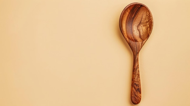 Photo wooden spoon with smooth finish on beige background