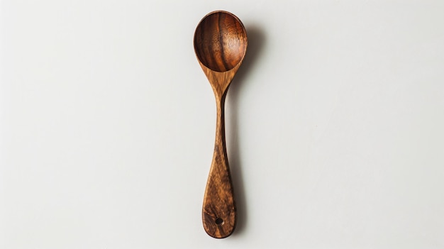 Photo a wooden spoon with a white background