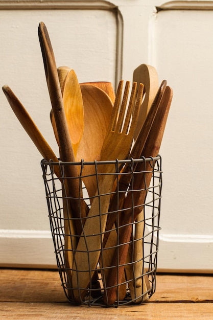 Wooden spoons in a wire basquet