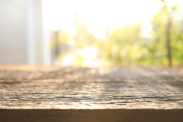 Wooden surface and nature view with sunlight