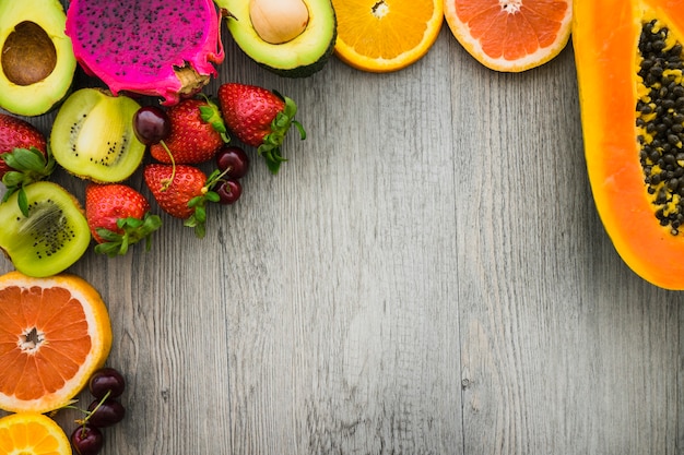 Wooden surface with delicious summer fruits