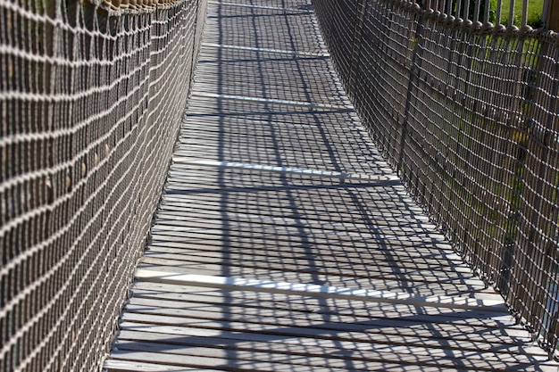 Wooden suspension bridge in public park